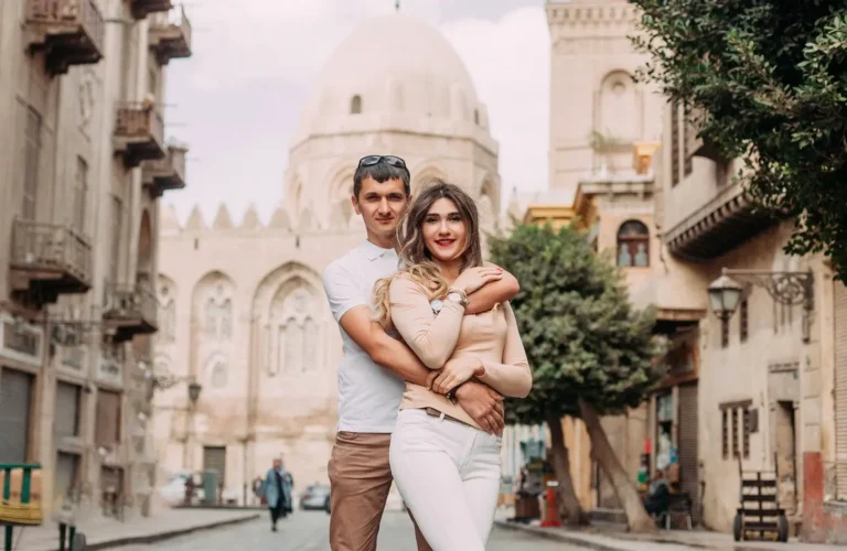 A couple strolling along Al-Muizz Street in Cairo