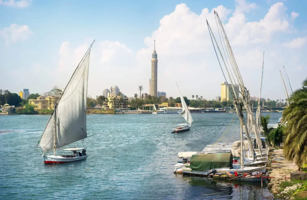 A felucca on the Nile with the Cairo Tower behind it