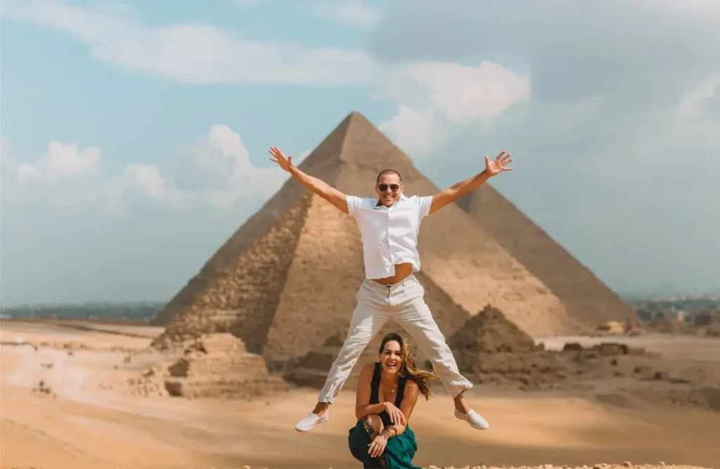 A couple in front of the Giza Pyramids