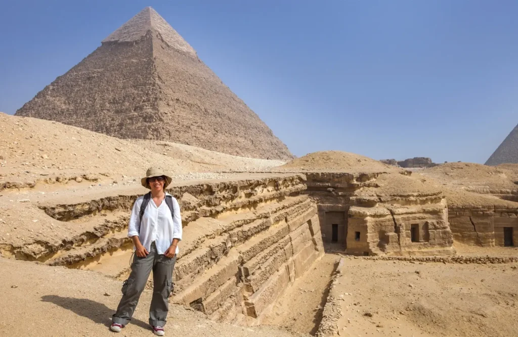 A visitor in front of the Great Pyramid of Giza