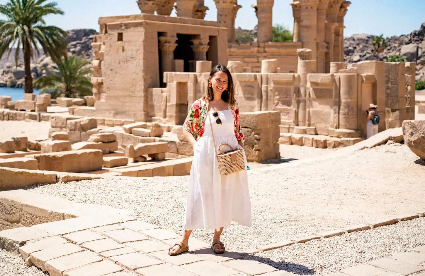 A visitor standing inside the Philae Temple